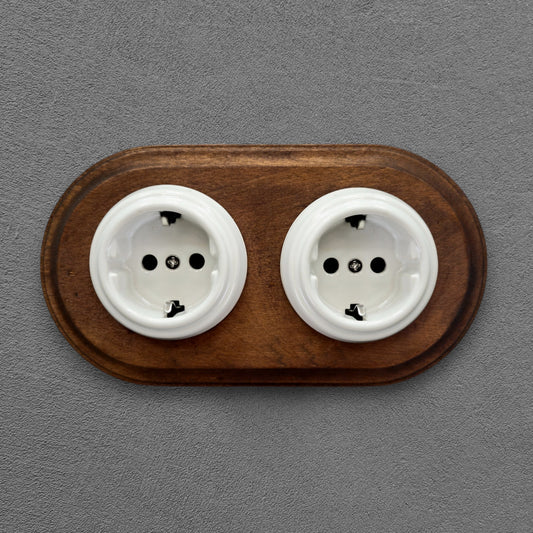 Double SCHUKO porcelain socket with dark wooden frame, white, flush-mounted, front view
