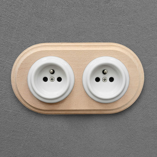 Double white Type F porcelain socket with wood frame, flush-mounted, front