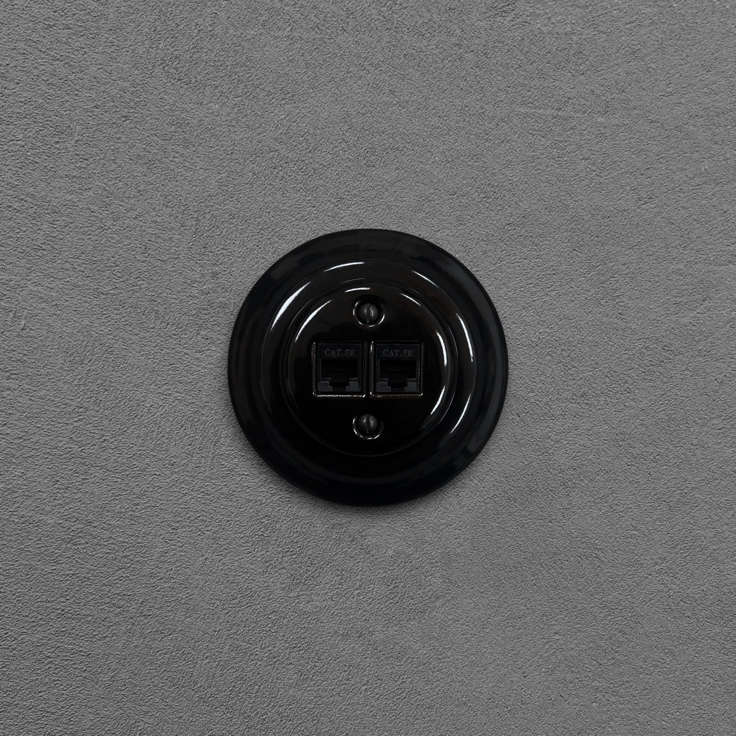 Black porcelain RJ45 Ethernet socket, flush-mounted