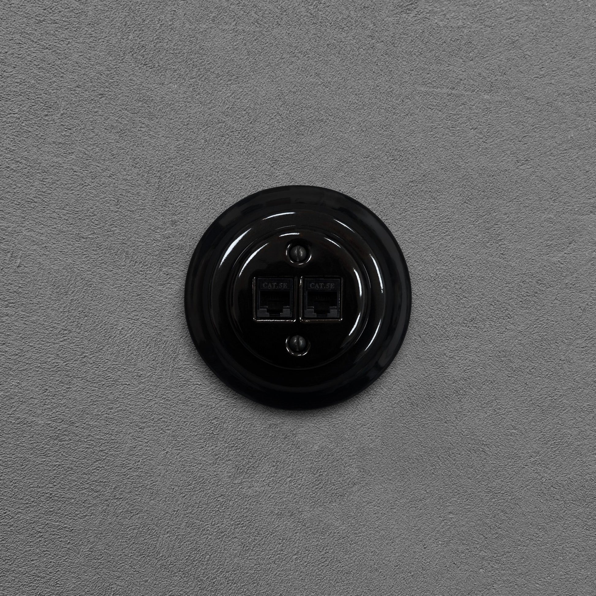 Black porcelain RJ45 Ethernet socket, flush-mounted