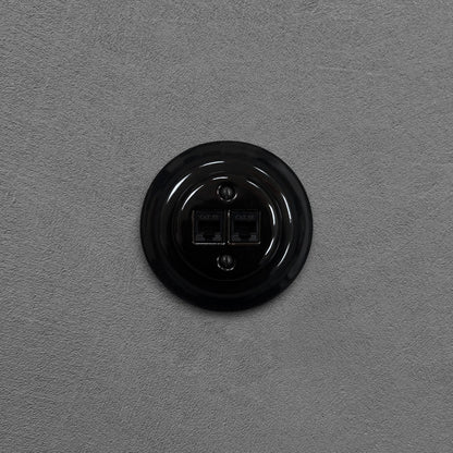 Black porcelain RJ45 Ethernet socket, flush-mounted