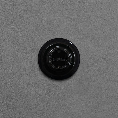 Single SCHUKO porcelain socket, black, flush-mounted, front view