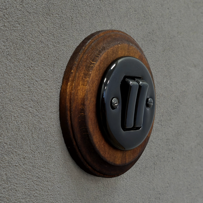 black porcelain 2gang2way light switch dark wood frame, flush-mount, angled