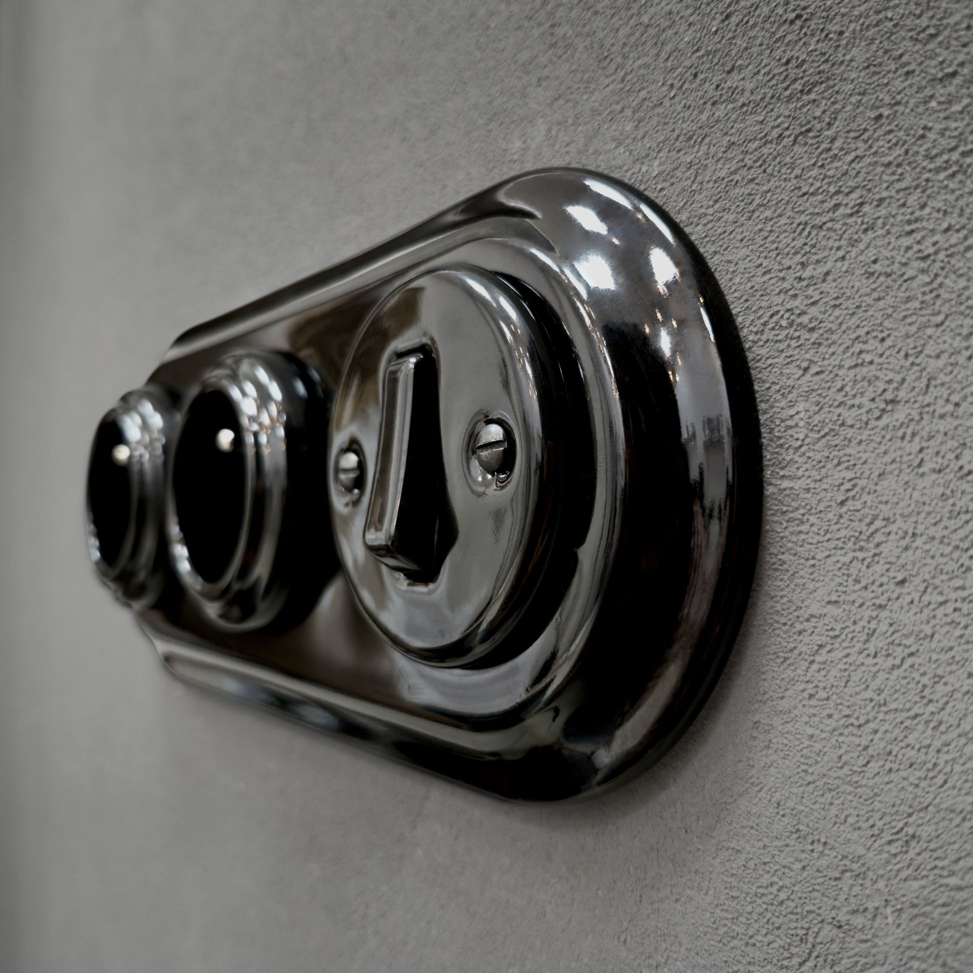 Double black French porcelain socket with light switch, flush-mount, angle