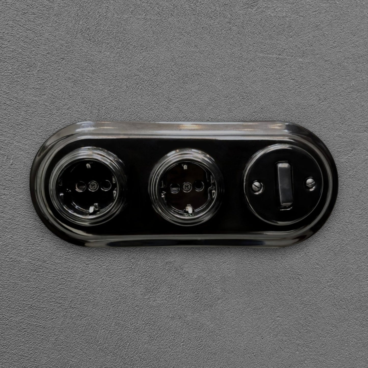 Double SCHUKO porcelain socket with light switch, black, flush-mounted, front view
