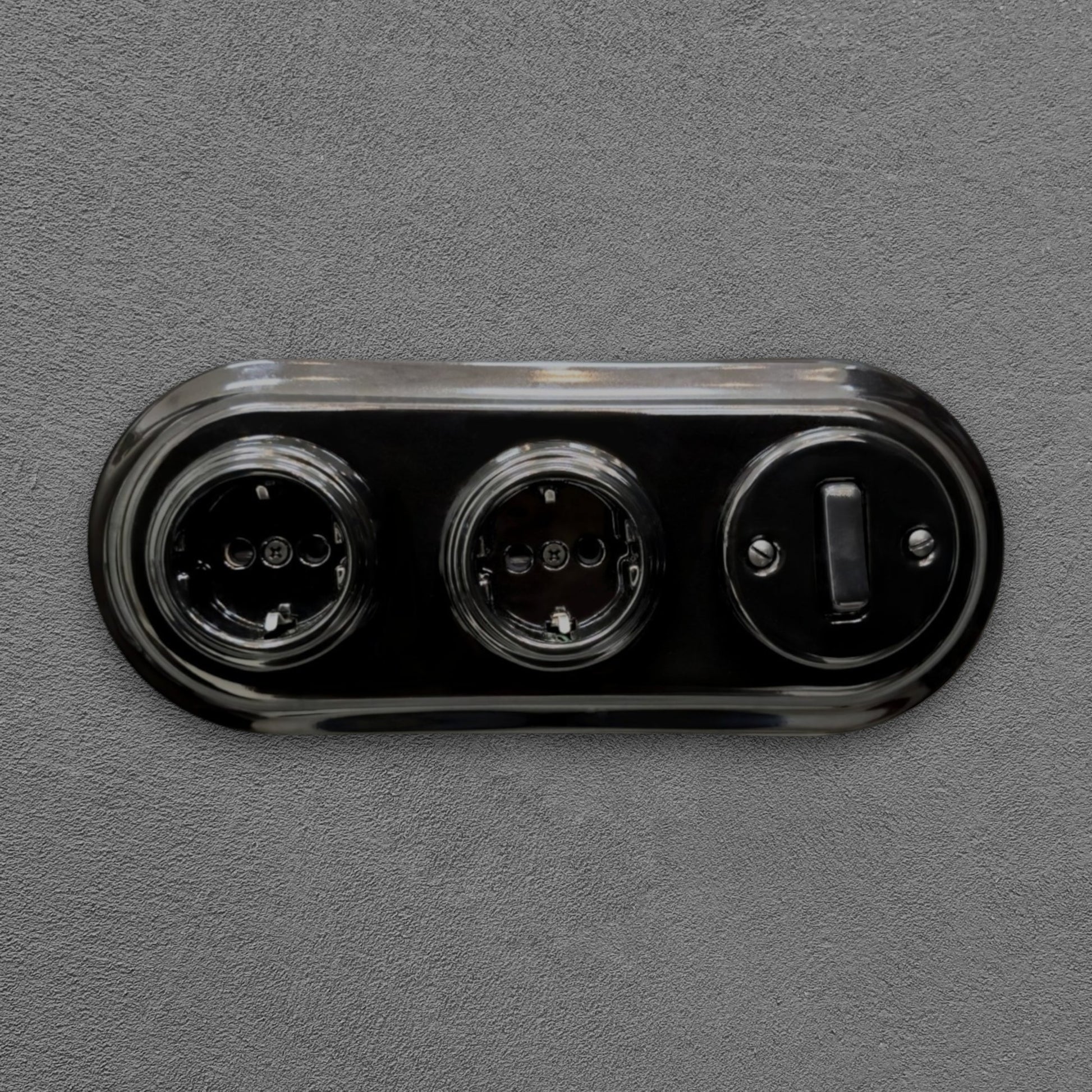 Double SCHUKO porcelain socket with light switch, black, flush-mounted, front view