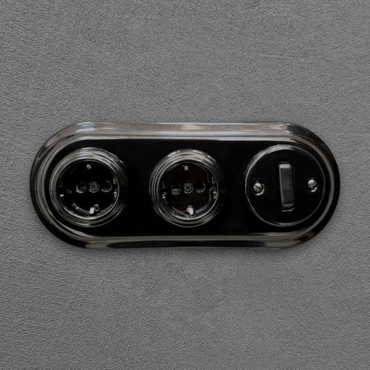 Double SCHUKO porcelain socket with light switch, black, flush-mounted, front view