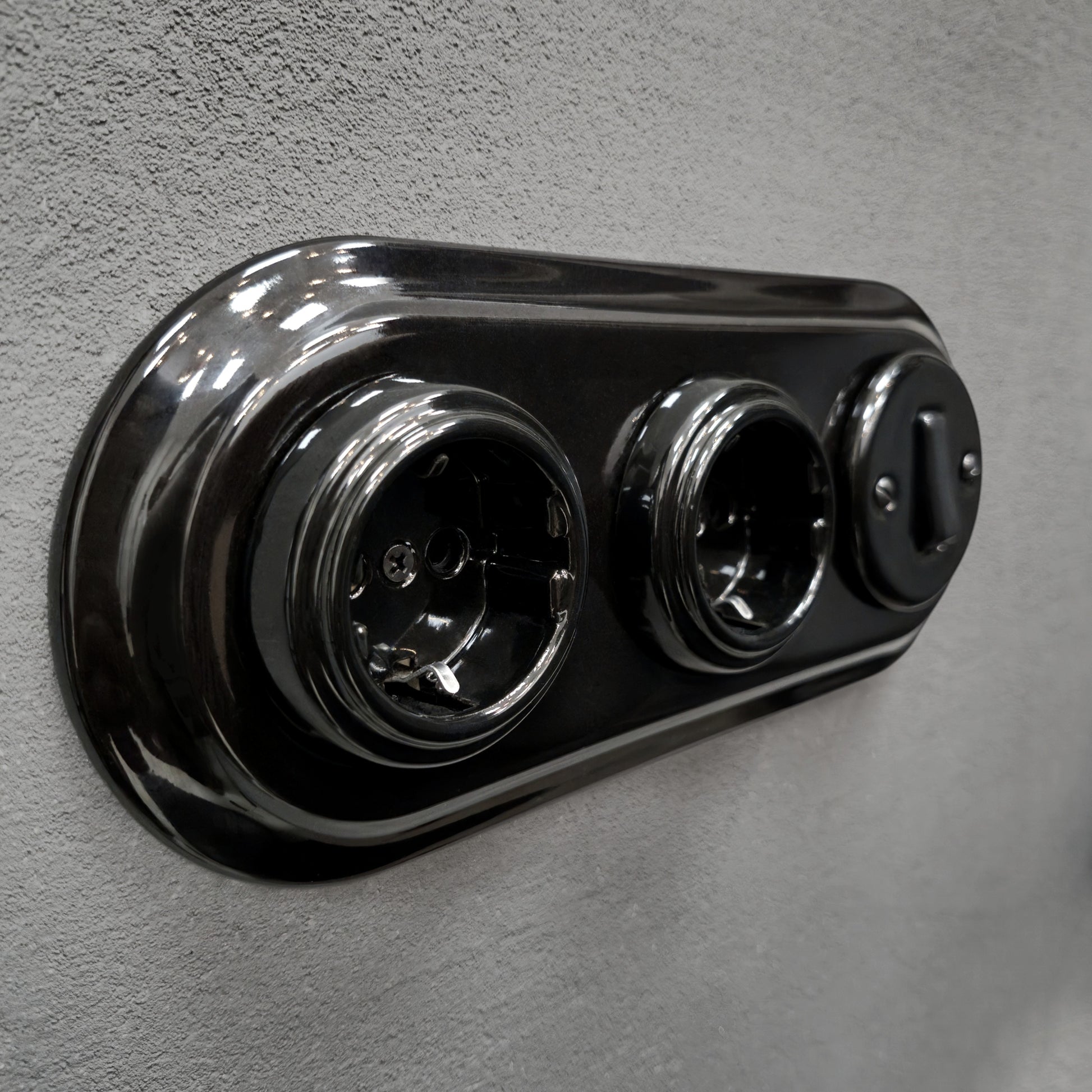 Double SCHUKO porcelain socket with light switch, black, flush-mounted, side view