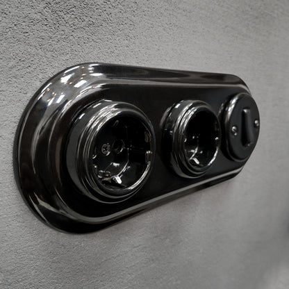 Double SCHUKO porcelain socket with light switch, black, flush-mounted, side view